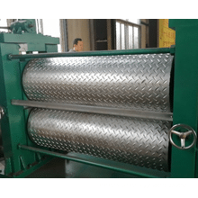 Metal sheet embossing machine